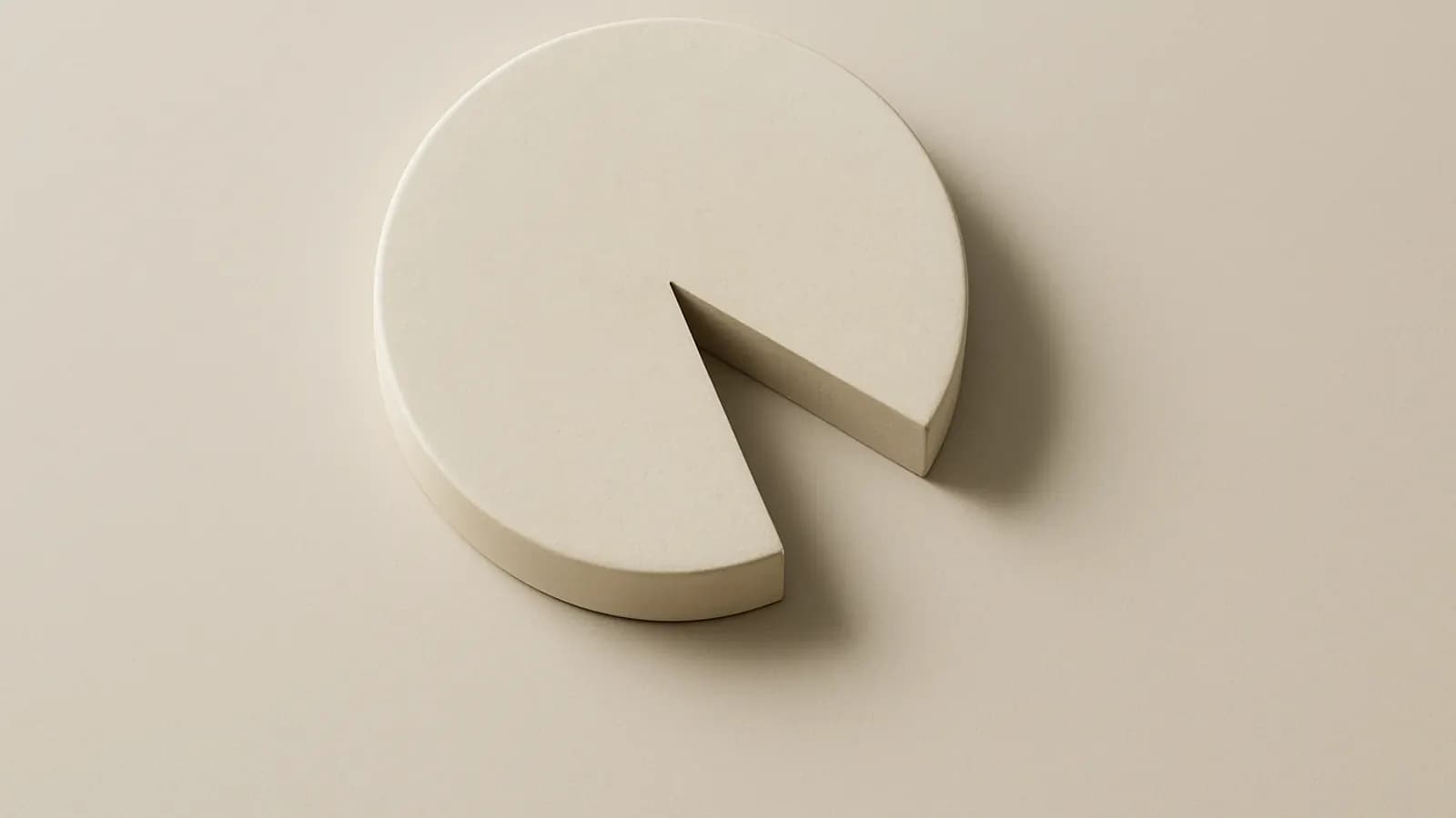 A plain cream ceramic disc seen from above with one wedge-shaped slice cut away and set apart.